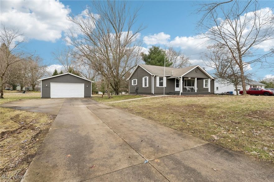 Welcome home to this beautifully updated ranch, located on over an acre in the Kent Local School District!  Walking up to this home, you're greeted by an oversized, covered front porch.  Entering the home, you will notice the open floor feeling with natural wood floors running throughout the home.  Large living/family room as you enter, leads back to open kitchen area. Kitchen has opening into living/family room and dining area. Ample countertop and cabinet space, with additional walk in pantry. 2 large bedrooms located on the far end of the home, with full updated bath.  Heading down your own private hallway you'll find an oversized master suite, with natural light and vaulted ceilings.  Master bath with jacuzzi tub, and large walk-in closet.  Downstairs doubles the space available for this home, with room under addition that can be easily finished for additional living space, with egress windows.  Laundry located in lower level, with plenty of room for storage.  Water softener and other mechanicals have been updated as well. Oversized, detached garage has electric and garage door opener.  This land is perfect, situated on a corner lot, the possibilities are endless!  Schedule your showing today before this one is SOLD.