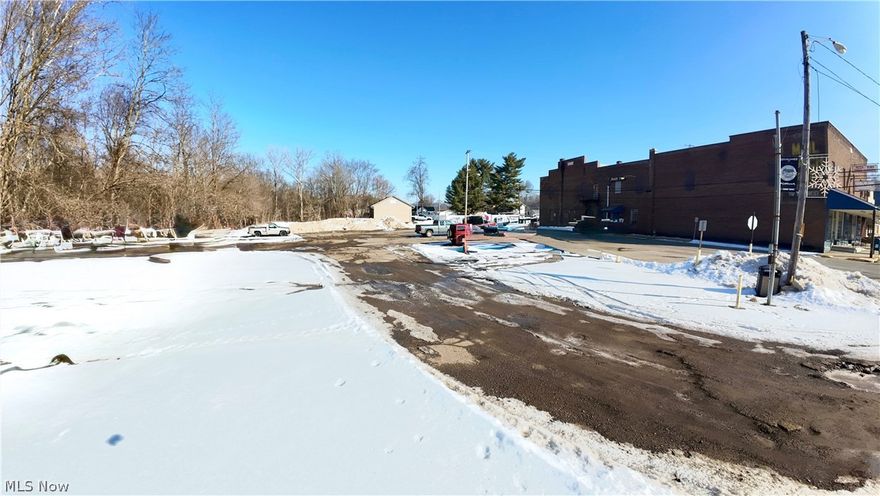 Online Auction begins ending Wednesday, March 18th, at 5:00 PM. Parcel 2: Parking lot on 0.887 acres w/ Killbuck Creek Frontage. Frontage on W. Front St. and N. Water St. Here is a rare opportunity to purchase a landmark property deeply rooted in the local lore of small-town America. Located in Killbuck, Ohio, this building has been home to various businesses since 1913, most recently operating as a convenience store and still housing the town’s Post Office. The main floor offers approximately 8,118 square feet and includes the storefront areas along with ample storage space in the rear of the building. The second floor features a theater and apartment units, presenting a value-add opportunity for renovation and redevelopment. An additional parcel is included, providing approximately 218 feet of frontage along Killbuck Creek. This parcel is currently used as a parking lot and is rented on a month-to-month basis, offering immediate income with long-term flexibility. With its historic character, multiple income streams, and redevelopment potential, this property offers a wide range of possibilities. Bring your vision and invest in a true piece of local history.