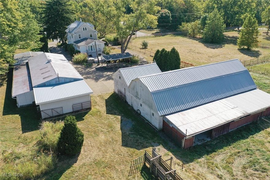 10 Acres with Two-Story Home, 8 Stall Barn, Dog Kennels, Six-Bay Garage, Pastures, Woods, Washington Twp., Marlington Schools. ABSOLUTE AUCTION, all sells to the highest bidder on location. ONLINE AND LIVE ON-SITE BIDDING WILL BEGIN TUESDAY, OCTOBER 15, 2024, 5:00 PM, REAL ESTATE SELLS AT 5:30 PM.
Real Estate. Excellent century 1,976 sq. ft. two-story home with rear addition. The main level features a foyer entrance, a front living room, a dining room, and an updated kitchen. Wood floors, woodwork, and pocket doors. The first-floor laundry, and a very nice full bath with a steam shower and sauna. Large back family room with cathedral pine ceiling, large closet, and doors to rear deck and hot tub. Three bedrooms and full bath up plus walk-up finished attic. Mostly replacement windows. Full basement with FA gas heat and CA. Concrete gated circle driveway covered front porch and picnic pavilion. 10-stall block barn and hayloft and covered lean-to. Dog kennels and pheasant pens. Six-bay building with overhead doors. Fenced pastures, woods, and run-in sheds. Adaptable to any type of livestock and 4-H project. Shown by appointment.