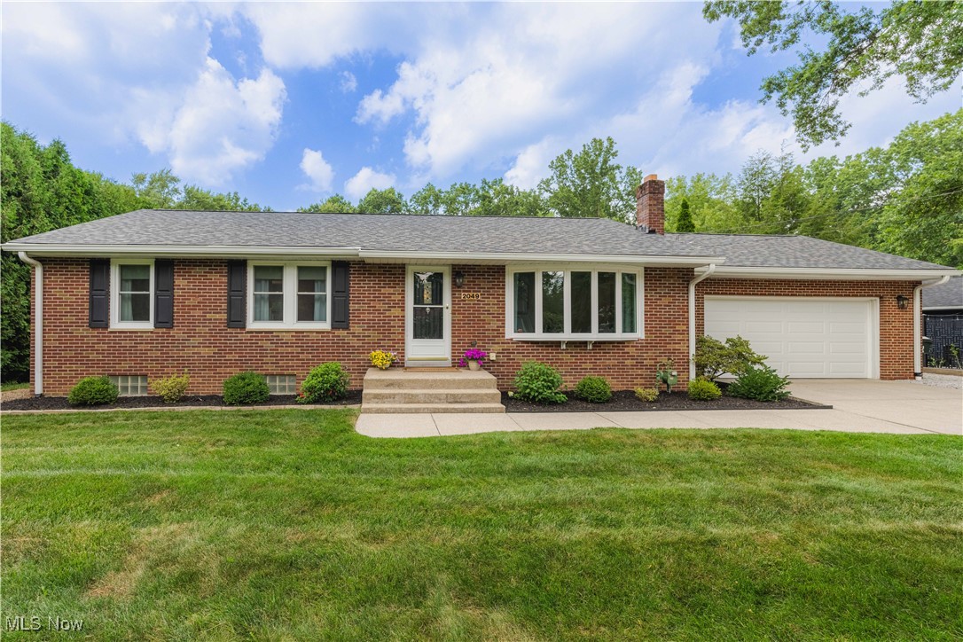 Welcome to this charming brick ranch nestled on .70 acres in Stow! From the moment you arrive, you’ll be captivated by the super cute curb appeal, lovely landscaping, and freshly mulched beds. As you step through the front door, you’ll immediately notice the abundance of natural light that fills the space, highlighting the beautiful floors and neutral colors throughout. The main level offers three inviting bedrooms, with newer carpets and paint. The eat-in kitchen features an abundance of cabinet and storage space, perfect for all your cooking and entertaining needs. The basement has been tastefully remodeled offering a bonus rec room/living room, a fourth bedroom and second full bathroom, and even a kitchen type space with LVP flooring and cabinets. Though there is not actively a wet bar option, plumbing is available if you’d like to add a wet bar feature in the future. If you love to enjoy your time outside you will love the flat back yard, with a lovely patio space, and a 2 car detached garage! This home has been meticulously maintained and thoughtfully updated: updates include but are not limited to : a brand-new roof was installed on both the house and the detached two-car garage in 2022, the main bathroom was fully remodeled with double vanities in 2023, new luxurious vinyl plank flooring and carpet were installed in 2021, recessed lighting added in the living room and hallway in 2023, all brand new windows on the main level in 2024, the basement was remodeled in 2022, completely painted throughout, removal of 6 oak trees to bright the yard in 2022, and more! Nearby walking trail leading to Indian Trail Elementary, perfect for walks or jogs. Plus, the home is conveniently close to shopping and Route 8. You definitely don’t want to miss this one, so call today to schedule your showing! Open house on Sunday, July 27th, from 2 PM to 4 PM!