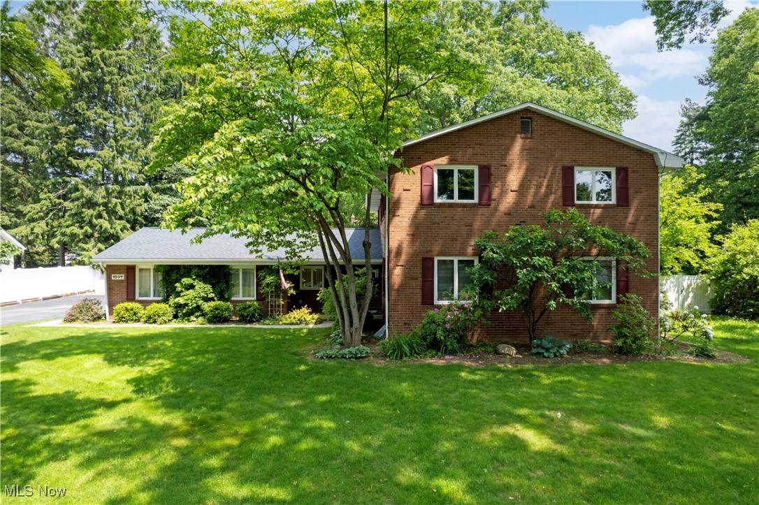 Prepare to be captivated by this amazing brick beauty! Boasting over 2600 square feet of living space, this exceptional home offers room for everyone. Step inside and discover spacious rooms bathed in natural light. With 4/5 bedrooms and 3 full baths you can not go wrong! The heart of the home is the kitchen – cozy yet packed with all the bells and whistles you desire, including a convenient breakfast bar. Imagine enjoying your morning coffee while overlooking the inviting step-down family room, complete with a warm fireplace. From the family room, step into the delightful four-season room, where you can enjoy views of the fenced backyard, covered patio, and handy storage shed year-round. The first floor offers incredible convenience with a laundry room, a bedroom featuring double closets, and a full bathroom. The large living room and formal dining room provide elegant spaces for entertaining. Upstairs, you'll find three generously sized bedrooms, two full bathrooms and a BONUS room that can be utilized for so many things ensuring everyone has their own comfortable retreat. The lower level provides amazing storage space, keeping things organized and clutter-free. For those needing extra space will appreciate the oversized two-car garage. This home truly has it all! Don't miss your chance to own this stunning property. Roof shingles approx. 2 years old. Furnace/AC approx. 5-6 years old, Water heater updated as well.