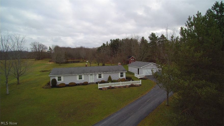 Looking for single story living in a rural setting yet close to all amenities? This 3 bedroom ranch is move in ready w/ updated, eat in kitchen that includes newer counters, sink & microwave and stove about 5 yrs. old. HVAC system was installed in 2018, house roof is about 14 yrs. old, windows about 10  yrs. old. Cozy up in the large living room w/fireplace. The big enclosed patio leads to patio & deck and all overlook the beautiful backyard w/view of the pond. The detached garage w/workshop offers a heater that just needs connected to propane. The 16 x 20 storage barn behind the garage offers options for various uses. New front door w/storm door in 2020. Seller is having new septic installed ASAP in 2022. There is an easement in place for the shared drive from (3494 Austinburg) road to this property. Nice property being sold AS-IS~inspections for buyer's knowledge only.