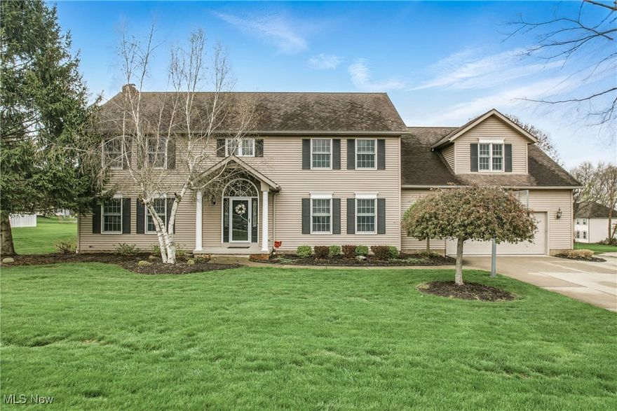 Nestled on a lush corner lot in a desirable neighborhood of Wadsworth, this incredibly maintained 6 bedroom Colonial is certain to check all your house hunting boxes. Grand foyer welcomes you into the open concept great room, kitchen, morning room area. Need a kitchen large enough for big family gatherings? Your wish just came true. Kitchen features Amish built maple cabinets with pullouts, pantry cabinets, granite counters, tile backsplash, morning room eat-in area, and island that will be the spot for all to gather around. All flows nicely into formal dining room which could also serve as a home office. Family room gas fireplace with a blower to keep you warm and cozy. Half bath and Mud room with built-in cubbies to accommodate coats, shoes, book bags, sports gear, and are conveniently located right inside from garage or backyard entrance. Put on your walking shoes - the 2nd floor goes on and on.  As you ascend the beautiful foyer staircase, you're met with an owner's suite that will be a relaxing retreat. Ensuite bath with walk in tile shower, double sink Corian vanity and water closet. No need to fight over closet space, there are his and her walk in closets.  Right next door you'll find the first guest bedroom, perfect for nursery or home office. 4 additional bedrooms, huge storage area, away room for gaming or study nook, and an oversized guest bath complete 2nd floor. This just any guest bath, it features Corian countertops, double sink vanity plus a single sink vanity and tub/shower combo. Lower level will be your favorite hang out with nearly 900 square feet of finished living space, complete with rec room, wet bar, full bath, and additional space for home gym, workshop or simply additional storage.  There's plenty of greenspace to play, plus paver patio with gas line for grill, and beautiful composite deck. Two car garage has plenty of extra room for lawn equipment, toys, bikes and more, plus the basketball hoop is all set up for some outdoor fun.