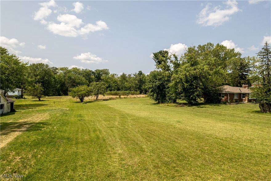 Deep level lot with small field and woods in the rear. This 1.42-acre plot is perfect for your dream home with electric, gas, water, and sewer available at the street. Located about 1.5 miles from IR 77 and located by many local communities: Enjoy the numerous parks around Portage Lakes, several local museums, Belden Village mall, Amish country in Hartville, and a plethora of shopping, restaurants etc in all surrounding areas. Call today to schedule a tour!