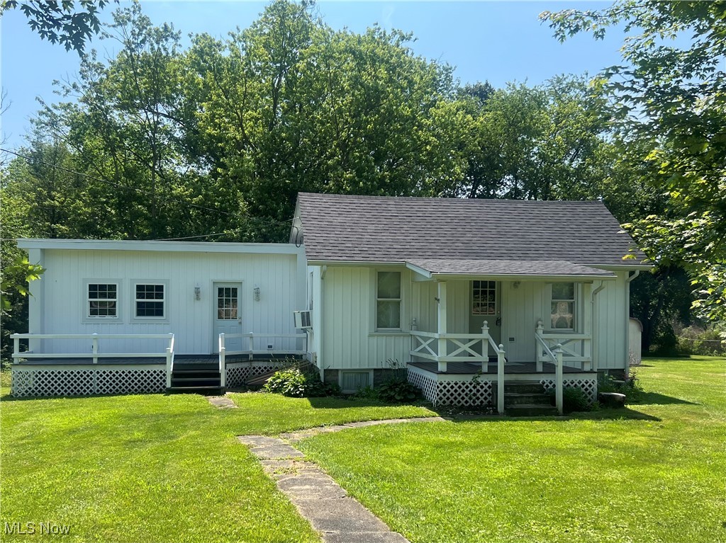 Charming 2-bedroom, 1-bath cottage-style home nestled on a serene 1-acre lot, the last house on a peaceful dead-end lane with only one neighbor. This inviting property features a new roof, durable batten board vinyl siding, a covered front porch, and a rear deck perfect for relaxation. The home includes a 2-car garage, propane heat, and an applianced kitchen. New leach field and survey recently completed. Spectrum cable/internet available. Enjoy the wooded backdrop and open field beside the house, offering privacy and natural beauty. A spaciousRoom beside largest bedroom would ideal for a hobby room, nursery or child’s play room or office. This desirable location near the interstate ensures easy commuting. A rare find having been in the same family for over 60 years. East Muskingum Schools.