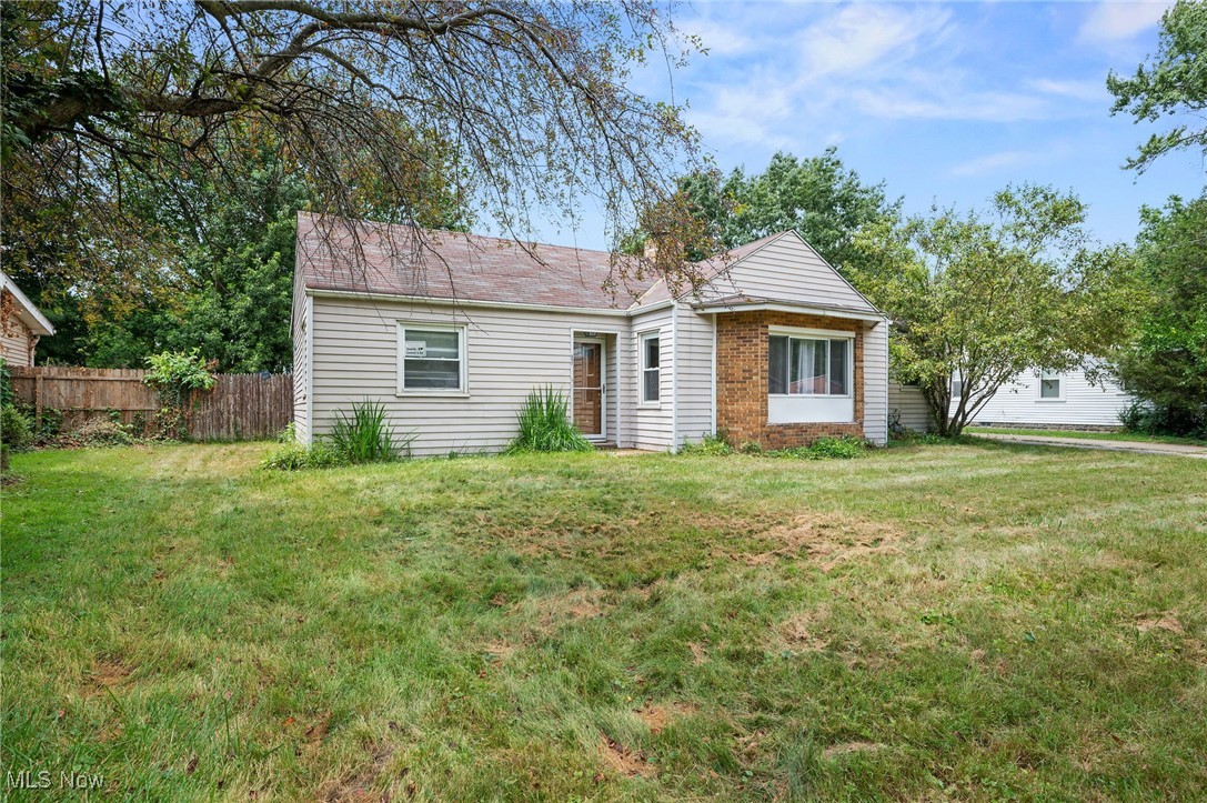 Welcome to this beautifully updated 3-bedroom, 1-bath ranch located in a quiet, desirable neighborhood in Willoughby, OH. Step inside to discover stylish, modern flooring that flows seamlessly throughout the home, enhancing its fresh and inviting feel. The spacious living room is filled with natural light thanks to corner windows and features a stunning brick fireplace—perfect for cozy evenings or entertaining guests. The sun-filled kitchen is as functional as it is charming, offering ample cabinetry and storage space, sleek tile backsplash, a generous center island, and essential appliances to make everyday living effortless. The thoughtfully renovated bathroom includes a roomy vanity and contemporary finishes for a polished look. A bright and airy family room off the back of the home is the perfect retreat to relax, work, or unwind, with sunlight pouring in from every angle. Outside, enjoy the expansive, fully fenced backyard—ideal for pets, play, or creating your dream outdoor entertaining space. Additional highlights include a two-car garage, central heating (with seller contribution toward central air installation!), and an ideal location near parks, schools, shopping, and more. This home offers the perfect mix of modern updates, warmth, and long-term potential. Don't miss your chance to make it yours!