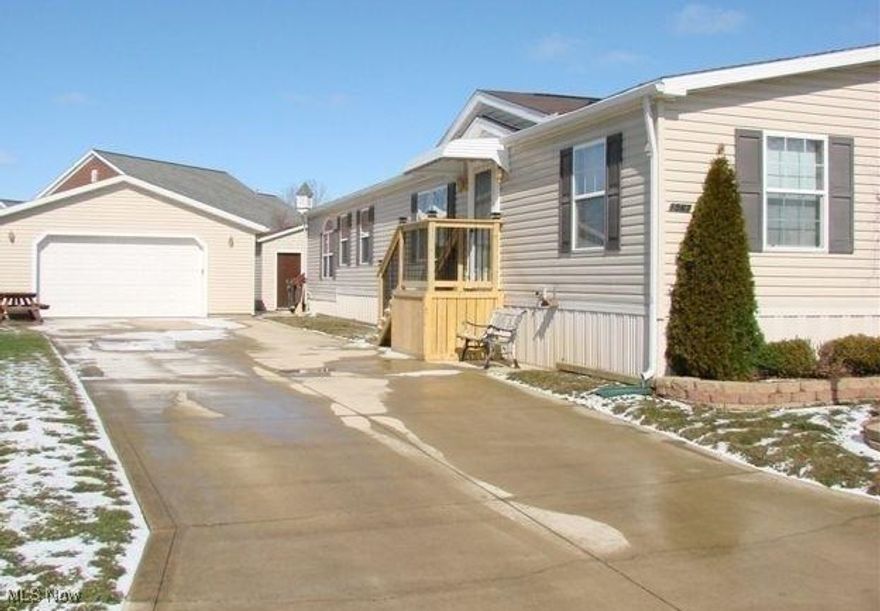 Extra large double wide home. With 1968 finished sq ft of living space. The home features one floor living with vaulted ceilings and family room with a wood burning fireplace. Four bedrooms with carpet and ceiling fans! Living room and dining room features skylights and sliding doors to large wood deck. Master suite features sunken sitting area with step up to sleeping area plus a walk-in closet and glamour master bath with jetted soaking tub, step in shower and double sink and skylight! Laundry room and a half bath off family room. Double wide driveway leads to an oversized two and a half car detached garage that has both heat and electric. Also a 10x10 storage shed is a plus! Cement patio area and second deck on side. One of the largest manufactured homes in Golfway Pines!