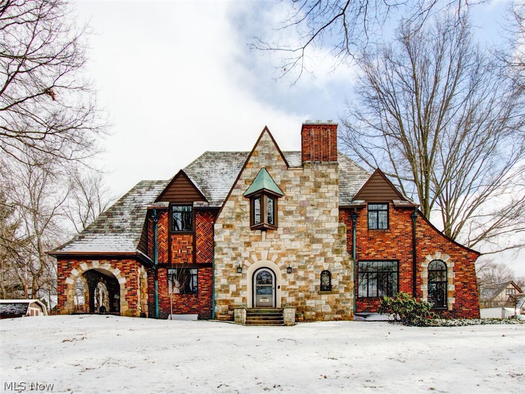 WOW!! ABSOLUTELY GORGEOUS AND COMPLETELY RENOVATED WEST AKRON TUDOR! Fabulous new kitchen with granite countertops, stainless steel appliances, travertine heated floor, huge center island and custom tile backsplash. Grand formal dining and living rooms with an exquisite fireplace and gorgeous leaded glass french doors leading to a sunroom or office. Rich hardwood floors and wrought iron staircase. Master suite with fireplace and completely updated bath with Carrera marble & glass shower and heated floors. Lower level offers a recreational room and bath. Extensive updates include new 2 zone central air, electric panel, complete basement, kitchen and bath renovations, refinished floors, paint inside and out, new hot water tank, garage doors, door openers, renovated laundry room, new carpeting and so much more! A must see!!