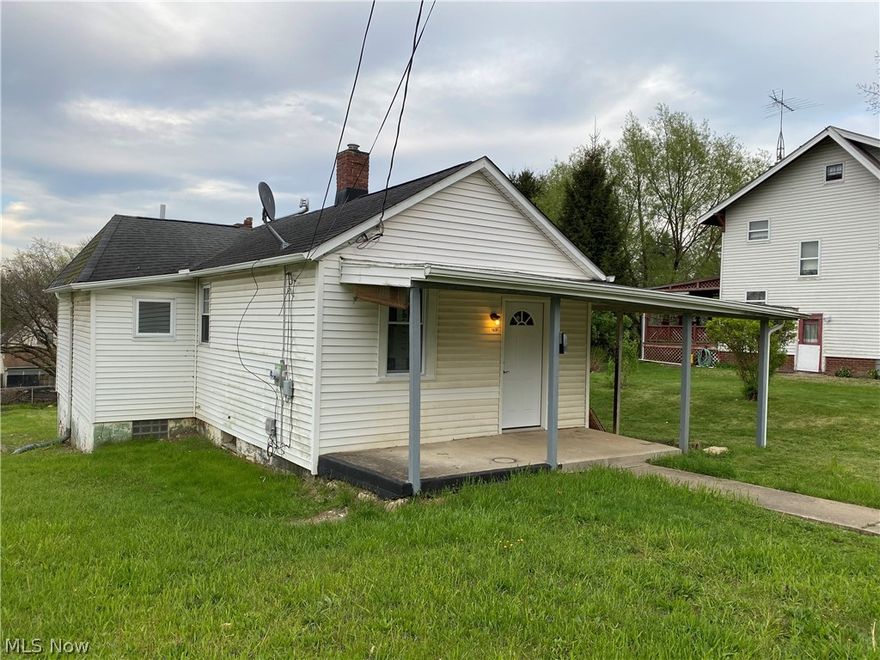 Fantastic starter or downsizing home.  Would also make a great rental.  Remodeled with all new paint and flooring throughout.  Home has an inviting front porch and a walk out basement with access to driveway off alley. Room between kitchen and bath could be used as first floor laundry.   Home also comes with an extra lot so you can enjoy the large outdoor area.