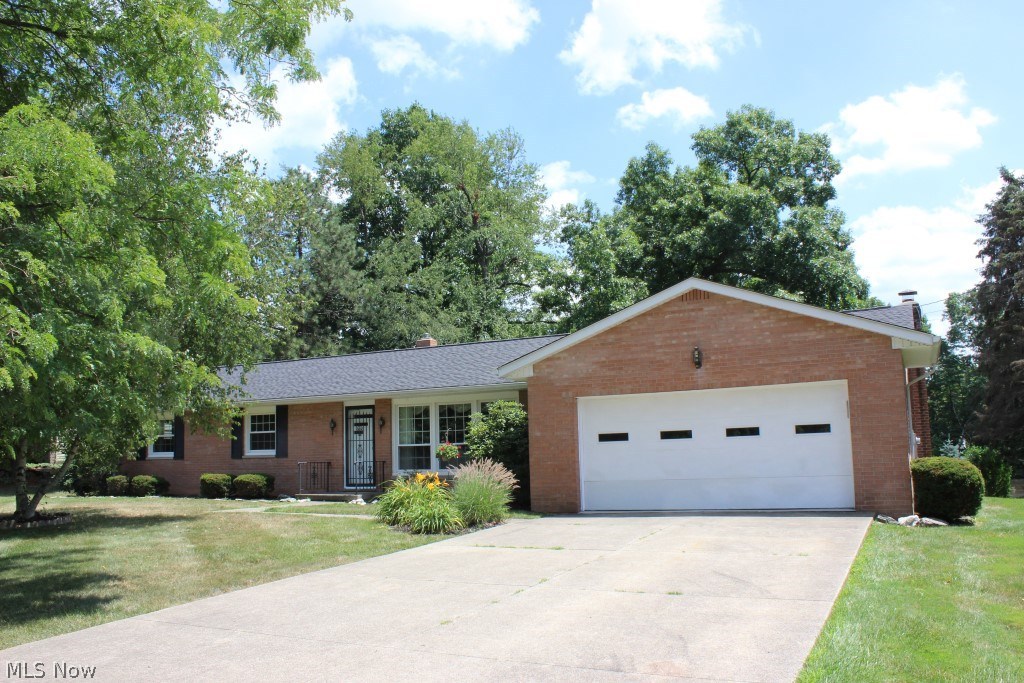 Beautiful all brick 3 bedroom, 2 bath ranch* Neutral décor throughout* Private setting on .71 acre lot backing up to the Tuscarawas River* Oversized updated windows letting in abundance of light, wood floors under carpet in living room & bedrooms* Approx. 1634SF (main level)* Formal dining with oak floor* Oak kitchen with wood like laminate floor, stainless refrigerator (2.5 yrs), stainless gas range, dishwasher, disposal & breakfast bar* 1st floor family room with brick wall with gas log fireplace and slider to 3 season sunroom* Sunroom wrapped with windows & sky light* Master bedroom with private bath* 1st floor laundry (located in guest bedroom) includes stack washer & dryer (4 mos. old) plus laundry in unfinished basement* 2 car attached garage with glazed walls, service door, water & opener* Updates include windows (2006), shingles (2007), softener & electrical service box (approx. 2 yrs.), hot water heater (2012), pressure tank (2014) & updated furnace & A/C* Storage shed* Just m