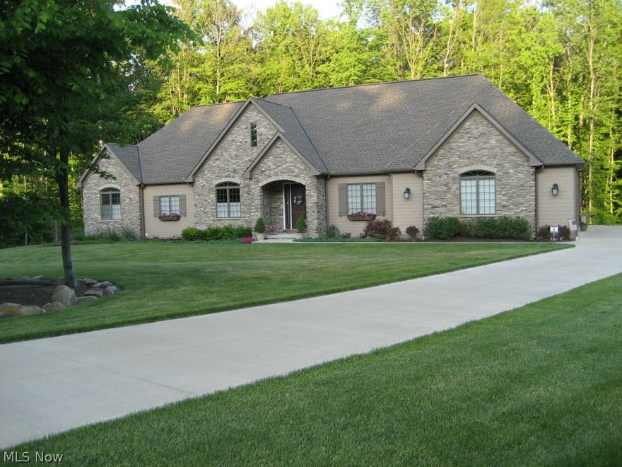 This spectacular 3 year old, 3 bedroom, 2.5 bath, 4car garage ranch in Hinckley Twp, on a beautiful 2.5 acre wooded cul de sac lot welcomes you. A Great room with true wood burning fireplace.  Kitchen is a gourmets delight, leads to a deck overlooking the private wooded back yard.  Master Suite with full bath, offering double sinks, garden tub and large shower, with a large walk in closet.  First floor laundry/office, plus too additional bedrooms. 10' ceiling through out the home.  Four car garage with ample parking.  Large unfinished basement, pre plumbed for future bath. Security system, vacuum system, landscape lighting. Sprinkler system.Energy efficient furnace and a/c with ten year warranty. Nothing to do but move in!!!!