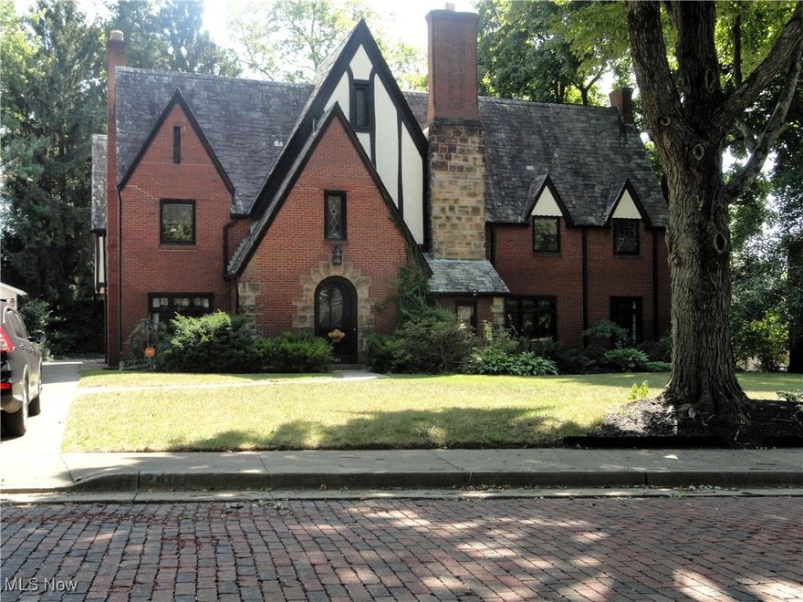 This magnificent English Tudor, located in Historic Ridgewood, is an opportunity you will not want to miss out on! Ornate Crown Molding, unique Ceiling Medallions, grand Arches, Fireplace with Mahogany Mantle, professionally refinished Hardwood floors, elaborate Iron work, are the characteristics of this Home!  Inviting Entryway with unique Glass door, formal Living room with French doors leading to a peaceful English Garden with Fountain, a covered Patio, and a private Backyard for your evening of relaxation. Library with built-in bookcase. Formal Dining room, remodeled Kitchen with Granite counters, KraftMaid cabinetry, and some NEW appliances. Breakfast room is a bonus adding charm & warmth. Master Bedroom with remodeled full bath, 3 more Bedrooms and a second remodeled full bathroom, the 5th bedroom with its own full bath was the "Maid's Quarter". One of the few Homes in Ridgewood that offers attached, 3-car garage. Additional features include Landscaping and Security lighting, irrigation, paved concrete walkway, circulating hot water system, cedar closet, and many updates. This exquisite Home is a must see to appreciate all of its Beauty!