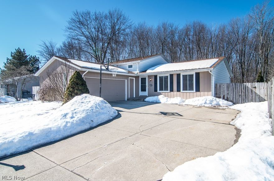 Welcome home to this amazing split level - super clean, pride of ownership!  Walk in the front door to a tiled foyer that has a large closet and open to the bright Living Room that features Prego flooring and large windows for natural light.  Walk through the foyer into the eat-in Kitchen that has a ton of cabinets for storage, plenty of countertop space, a dinette area and . Walk out of the patio door onto a patio that is great for entertaining.  The secluded yard backs up to woods and has a deck that leads to the pool.  Off of the Kitchen is a lowered Family Room with fresh carpet and wood burning fireplace.  The lower level also features bedroom #4 and a full bathroom.  Upstairs has 3 additional nice sized bedrooms, all with huge closets and laminate wood floors.  A large full bath with 2 sinks and laminate floors finish off the upstairs.  The basement has a rec room with plenty of room for all of your furniture and a great bar.  Do not miss out on this great house!