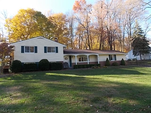*Motivated Seller* Beautiful split level home on a wooded lot with a wonderful addition - Open living room and dining room - Foyer and kitchen with wood laminate floors - Kitchen opens to 18x12 three season room with sliding door leading to the wooded backyard with deck - Kitchen leads into the relaxing family room with beamed ceiling and two sided wood burning fireplace - Three large bedrooms on second floor all have hardwood floors - Lower level features garden style windows and includes a rec room, bedroom and laundry room with shower. Nicely maintained and clean throughout. Appliances included. Perfect family home ready for a fast move in.