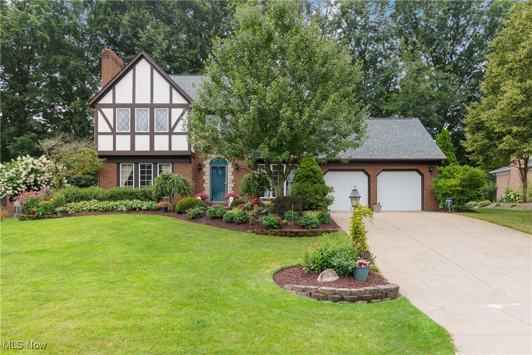 Welcome to this beautiful 4-bedroom, 2.5-bathroom Tudor style brick/Stucco home with beautiful woodwork, the amenities (skylight, central vacuum system) park like garden and great location at Perry Local Schools. Freshly painted rooms with great bones and incredible potential, this property is your perfect opportunity for bringing final touch to life. The main level features a formal dining room, first-floor laundry, and an office with bookcase or additional living space, ideal for remote work, playroom, or den. The heart of the home offers open floor plan to flow from foyer, office, living room, dining room to kitchen for your daily living and entertaining. The living room is with either a gas log or wood burning fireplace for extra comfort and cozy space. Lots of natural lights throughout the property to bright up your day. Upstairs, you'll find a generously sized primary suite with an attached private bathroom featuring a Jacuzzi tub and skylights, along with three additional bedrooms and a full hall bathroom—plenty of space for family, guests, or hobbies. The full basement is with additional laundry hooked up, a shower and toilet for another full bath, plus extra room for storage space. Newer hot water tank, routine serviced furnace/AC and a new roof (July 2024). Outside, professionally designed landscaping and a spacious enclosed sunroom to enrich your outdoor life for gardening or relaxing in the beautiful yards. An attached 2-car garage with a back door access for the convenience to the back yard. The property is selling as is. Bring your ideas and make it shine for a project of your showcase! The owners built and have lived in this property since then. Don't miss the chance to check out this amazing property! Schedule your private showing with two hours lead time!