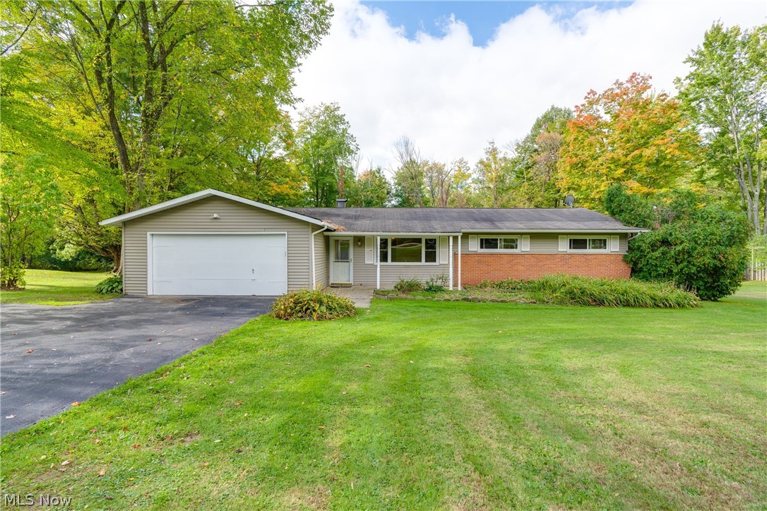 Beautiful country home nestled in highly sought after Chagrin Falls. Everything you need, all on one floor. When you walk through this home you'll notice that everything is fresh and clean, ready for you to move right in. Fresh paint from top to bottom and brand new carpet throughout. Formal dining room with fireplace, living room, separate family room with vaulted ceiling, nice sized eat-in kitchen, four spacious bedrooms, two full bathrooms and laundry room. Sit on the patio and enjoy the view of your wooded one and a half acre lot. Excellent location, out in the country but just minutes from all the amenities. Many nearby parks for biking, riding, hiking, fishing, and golfing. Two car attached garage. All appliances included (range, microwave, refrigerator, dishwasher, washer and dryer). New furnace and A/C installed 5 years ago. Entire house was completely re-wired in 2008. Schedule your showing before it's gone.