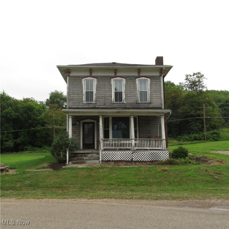 1800's 2-Story Home on approx.3.4 Acres near Leesville Lake! If you're looking for some history to research and restore you may be in luck. Tax card lists this house at 1680 square feet of living area with high ceilings, several non-working brick fireplaces, updated flooring, newer kitchen cabinets and updated bathrooms on both levels The living room has an amazing bay window and the large laundry room off of the kitchen can serve as a pantry as well. Basement has fieldstone walls and newer propane furnace. Shingles on roof, electrical service, and replacement windows are updates also. Property has a 20'x24'block detached garage, water well, and septic system that has passed the county required inspection. Situated in the historic platted village of New Hagerstown, it's a short drive to the Southfork Marina on Leesville Lake and handy to Tappan Lake as well. No zoning nor restrictions so horses and livestock are permitted. Level laying lot with lots of possibilities. Sellers do not own the minerals. Come sit on the porch and see what country living is like. Call to schedule your viewing!