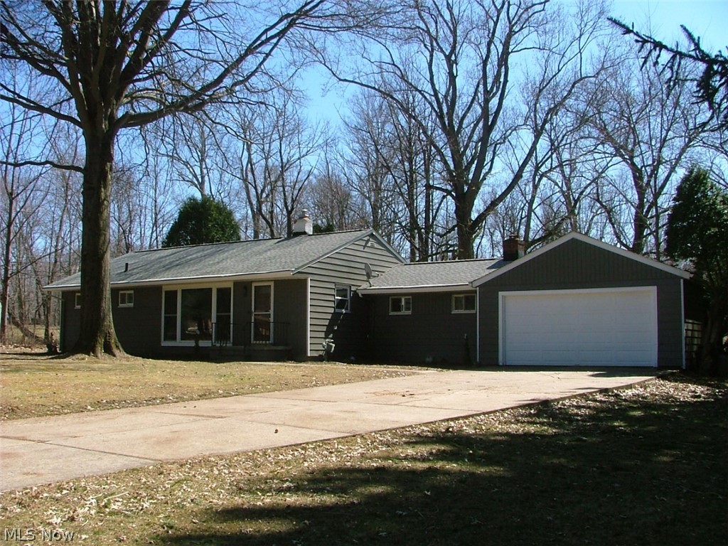 Nicely updated Ranch on 1.19 acres in the serene Village of Walton Hills. Hardwood floors, Family Room with woodburning Fireplace, Three Season Room overlooking wooded valley. 2 Car Garage. Home has dimensional shingle roof, Thermo pane windows. Basement is waterproofed with back up sump pump. New items include Furnace, A/C, All Electrical (Panel, Wiring, Outlets, Switches, LED Lighting), Garage Door Opener, Flooring in Kitchen and Bath(s), Toilets, Sinks/Vanities, Kitchen Cabinets with soft close, Apron Sink, Granite countertops, and Stainless Steel Appliances. Ready to move into and enjoy!