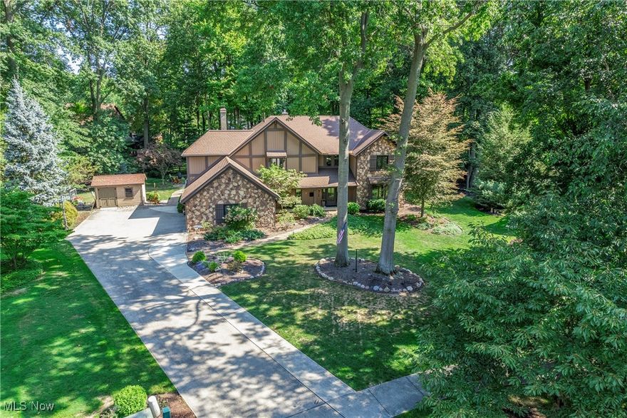 Beautiful home on a spectacular lot in sought-after Huntington Woods! Lovely cul-de-sac location with private, treed rear yard/ decorative lighting/natural pathways/new stamped concrete patio/pergola/firepit & Amish-built shed! Two-story foyer! Large living room! Dining room has wainscoting/hardwood flooring with inlays! Intricate crown/base molding throughout! Home office has built-ins/bookcases/chair rail/lower paneled walls! Marble half bath! An addition doubled the size of the kitchen...totally decked out with 2 cooktops (gas, electric & grill), 2 wall ovens, Sub Zero refrigerator/freezer, double sink/prep sink, 2 islands (1 w/seating), built-in desk, glass-doored China cabinet, specialty lighting, beverage/wine fridge, room for 8-10 seat table, peaked ceiling with three skylights, large fold-out pantry cabinet...extensive mahogany cabinetry & marble countertops! Arched openings to family room with wood beamed ceiling, built-ins, lovely floor-to-ceiling stone fireplace with remote! Bar room with sink, fridge, vaulted ceiling, open shelving/cabinetry & stone wall! Second floor has three secondary bedrooms with carpet/double closets - one has built-in craft center! Stereo system in 5 rooms! Spectacular master suite has custom built-ins, tray ceiling, beautiful woodwork, gas fireplace opens to both master bath & bed! Bath has high ceilings, granite/marble/tile, large whirlpool tub, oversized walk-in shower, double sink vanity, dressing & commode area! Oversized dream closet w/storage island! Finished lower level has tons of built-ins, a full wet bar, workout area, full bath/walk-in shower & a second space used as a pool room with table/racks/seating! First floor laundry room has built-ins/granite/utility sink & newer Samsung washer/dryer! 2 1/2 car garage & pull-down storage! Recent updates include garage upgrades, leaf gutter guards (warranty), removed deck & added stamped concrete patio, covered pergola, Amish built shed...spacious custom home on lovely lot!!!