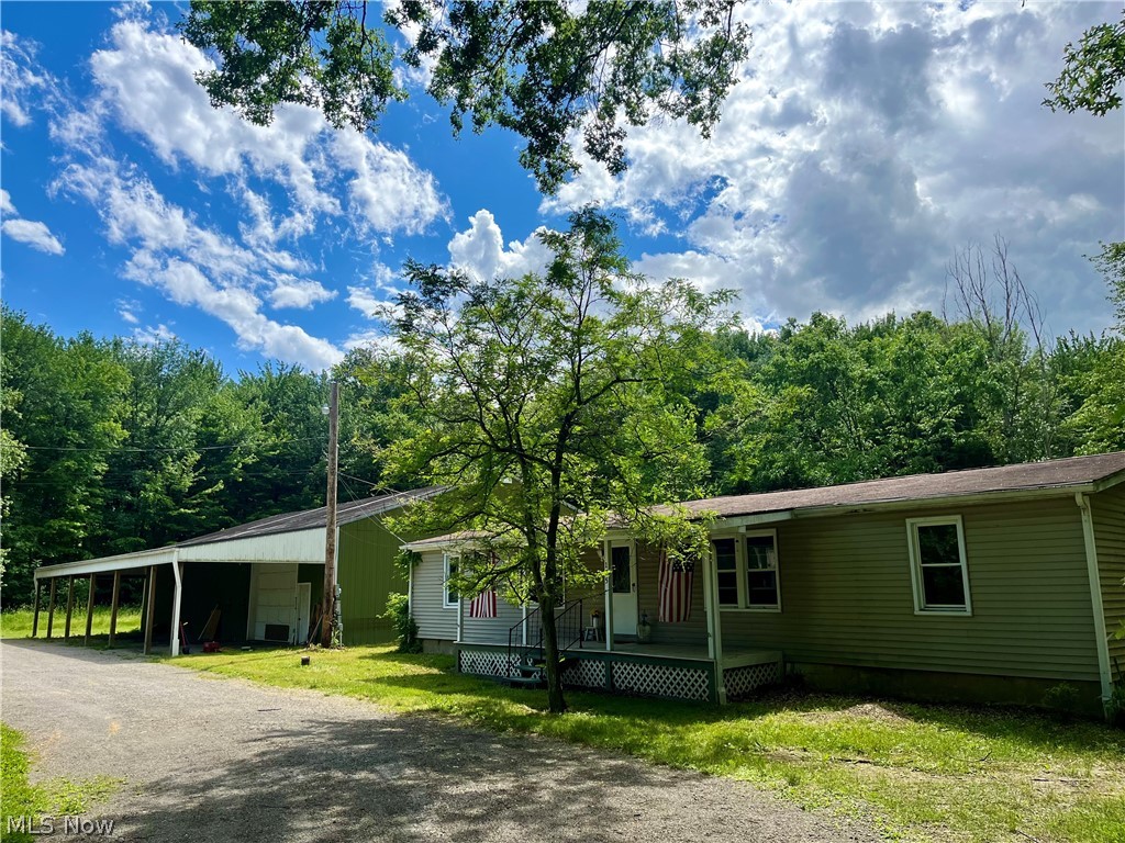 Motivated Seller!! This Fixer upper ranch home on tranquil 6.65 acres is ready for you to make it your own. Situated amidst lush woodlands, this property boasts a serene pond, adding a touch of natural beauty to your surroundings. Explore the expansive grounds, complete with a fenced-in garden, perfect for cultivating your own fruits, vegetables, and flowers. For those with a penchant for craftsmanship, two oversized outbuildings await your creativity. One features a convenient office space and workshop, heated for year-round comfort, offering plenty of room for hobbies, projects, or business endeavors. Escape the hustle and bustle of everyday life as you unwind in the seclusion of your wooded lot, providing privacy and tranquility at every turn. Whether you're enjoying a peaceful evening by the pond or pursuing your passions in the workshop, this property offers endless opportunities for relaxation and productivity alike. You won't want to miss out on this unique property! Give me a call to schedule a showing today!
This property is being sold as is executor will make no repairs.