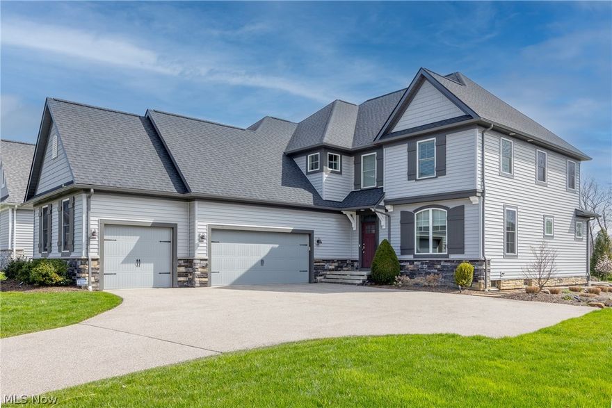 Elegance Meets Comfort in This Magnificent Modern Canyon Lakes Home in Chagrin Falls.A marvel that is only six years young, this immaculate home boasts four generously sized bedrooms and is equipped with all the modern amenities for luxurious living.The heart of this home is the open-floor design that seamlessly connects the living room, family room with a cozy fireplace, and dining room. All these spaces are complemented by the stunning views of the serene backyard visible through expansive windows.A chef's delight,the custom kitchen features sleek granite countertops, commodious pantry,high-end appliances,large breakfast island for casual dining. Working from home is a pleasure in the secluded and spacious office set off the inviting foyer.A thoughtfully situated 1st-floor laundry room adds to everyday ease of living.The luxurious master suite on the second floor is the epitome of comfort with two walk-in closets,ensuring ample storage space and privacy and Master bath with Jetted tub and a separate tiled shower.Two other bedrooms on the 2nd floor boast large walk-in closets and additional storage areas,providing plenty of room for comfort and organization.Full-finished basement features recreational room and additional bedroom with a full bath,ready to accommodate guests or serve as a teenager suite.Tankless water heater provides endless hot water on-demand with energy efficiency in mind.Ample space for vehicles and storage with a three-car garage and a large driveway.Step outside into a picturesque backyard complete with breathtaking views, relaxing hot tub,and stamped concrete patio perfect for entertainment and leisure.The convenience of sprinkler system keeps the landscape lush.Gain peace of mind with a one-year home warranty included.Experience the best of Canyon Lakes in a home that's been meticulously crafted for comfort,convenience,and splendor.Step inside your future home where every day feels like a luxurious getaway.