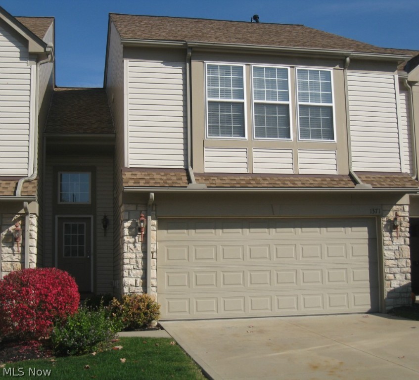 This super clean townhouse has new carpeting, fresh paint, includes all appliances and is ready for a new owner! Foyer leads to vaulted Great Room with brand new carpeting and soaring Palladium window for natural light. Eat-in Kitchen with maple cabinets and stainless steel appliances including range, refrigerator, dishwasher, and built-in microwave. Dining area has a slider that leads to the oversized patio with privacy fence. The spacious Master suite features a vaulted ceiling, window treatments, ceiling fan, walk-in closet & full bath. 2nd floor also includes another bedroom, full bath, laundry room w/ washer & dryer and small loft area for a desk or reading chair. Enjoy the walking trails, swimming pool, playground and common facility. Convenient to I-77, between Cleve and Akron, about 20 mins to Cleve Hopkins Airport. This property is available for immediate possession. Seller is providing a 1 yr Home Warranty & FHA buyers welcome!