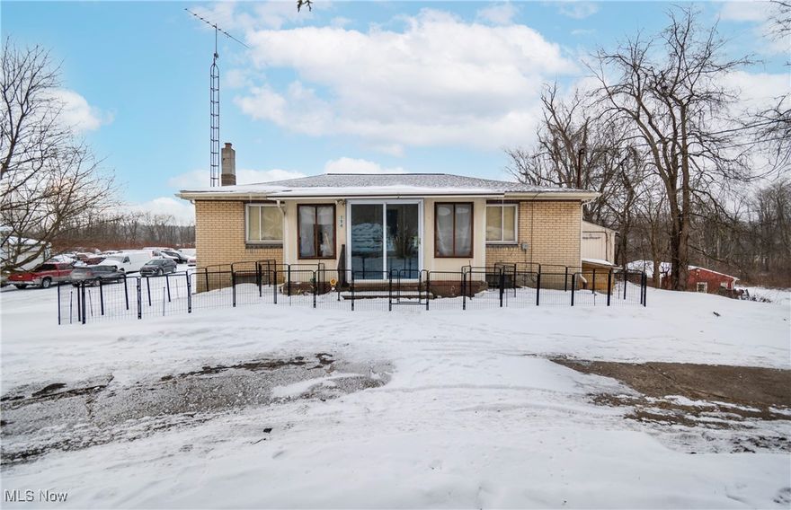 Discover this updated 2 bedroom, 1 full bathroom home on 6 acres in the Salem City School District. With an option for a third bedroom, this property combines modern updates with endless potential. Completely updated 10 years ago, this home features a newer furnace, roof, electric, and appliances, ensuring peace of mind for years to come. Enjoy the added convenience of an enclosed front porch, perfect for relaxing and entertaining. The spacious basement offers ample storage, while the oversized 2-car garage comfortably fits up to 4 vehicles and includes automatic openers. For those in need of additional space, the impressive 66x68 workshop is a true standout. Complete with heat in the back room, an office, and a half bathroom, this versatile building is perfect for hobbies, business ventures, or extra storage. The expansive lot provides plenty of room to enjoy outdoor activities or further expand the property’s offerings. Don’t miss this unique opportunity—schedule your private showing today!