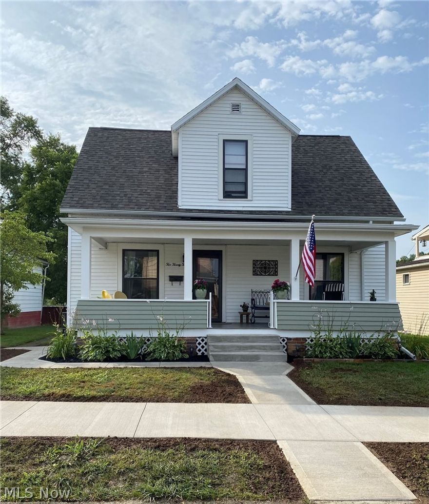 Completely restored beautiful 2 story home with original hardwood floors.  This home has many unique period correct features such as lighting fixtures, built-in corner cabinet, fireplace surround/mantel with electric insert/heater.  The kitchen has custom solid wood cabinets, newer countertops and newer fixtures and stainless steel appliances includes refrigerator, dishwasher, range and microwave.  Brand new main floor bathroom with laundry.  The master bedroom has it's own master bathroom.  Newer central a/c and furnace.  Basement has been waterproofed with newer sump-pump.  Newer Water softener.  Exterior trim paint and newer storm windows.  Newer roof with dimension shingles, soffits and gutters.  Newer concrete sidewalk and walkway.  All 4 porch columns replaced.  Newer front and rear storm doors.  Newer hot water tank.  Utility averages:  $85/electric; $115/gas; $75/water.