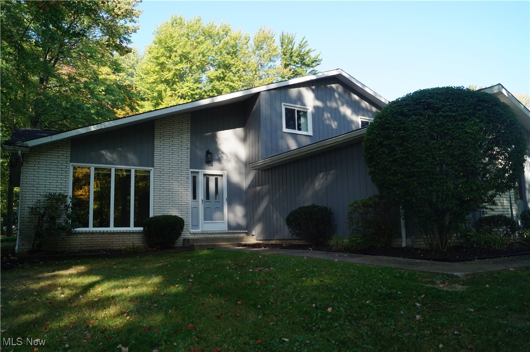 An exceptional opportunity awaits with this 1.8-acre property in Solon. Recent enhancements include luxury vinyl flooring (installed in 2020), new double hung windows (2024), garage door replacement, and fresh interior and exterior paint (2025). The bathrooms have been renovated with modern fixtures and ceramic tile in the guest bath. All bedrooms are updated with new ceiling fans and lighting; the owner's suite boasts a walk-in closet and direct access to the bathroom. The living and dining areas feature vaulted ceilings, while the living room is distinguished by floor-to-ceiling Pella windows (not replaced). Adjacent to the kitchen is a three-season room, and the foyer showcases a distinctive wall with three arches. Basement has new insulation on all walls, vented glass block windows with a shower and utility sink if you want to finish it. Garage is equipped with shelves for storage and electric outlet for EV and water spigot.