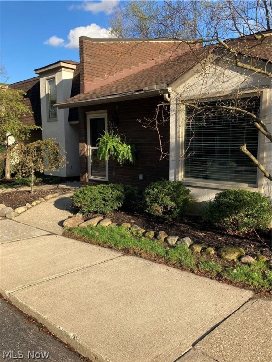 Welcome to this sharp, well maintained Townhome located on a quiet, wooded lot in Brecksville. This Split level 2 bedroom, 2 bathroom home has an office that can be used as a 3rd bedroom! All New Laminate flooring Installed throughout in 2018, Updated counter tops and backsplash in the kitchen in 2020. The Kitchen features a breakfast bar that extends into the dining room. The family room features a decorative fireplace, and sliders that open to a private, cozy patio complete with a storage shed! All levels have TONS of storage, including a large attic space located on the 2nd floor! There is a quiet Pool, and a heated Garage! HOA takes care of all landscaping, snow removal, exterior maintenance and repair. The furnace and AC are New in 2016. Screen door to patio will be repaired by Seller prior to close.