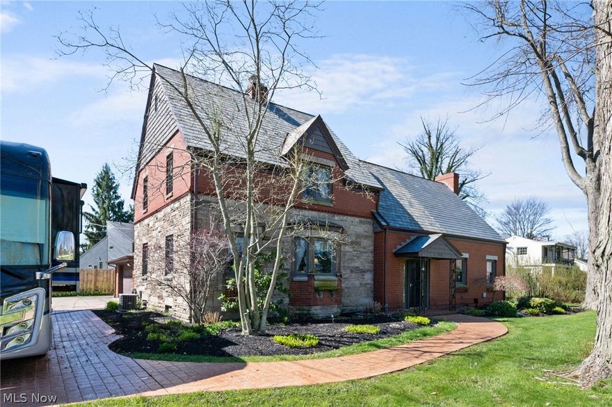 Pride in ownership is displayed throughout this home. Step into this exquisite gem close to Lake Erie showcasing wonderful brick and stone work Tudor style craftmanship with 3 bedrooms and 2 full baths. The galley kitchen has updated stainless steel appliances and was newly painted along with the dining room. Off of the dining area is an inviting room with lots of natural light and a cozy fireplace. Continue from this cozy respite through the foyer to the expansive family room with another fireplace and sliding doors to the outdoor deck area complete with a permanent pergola adorned with curtains for added sun blocking on those hot summer days. Upstairs of this "you'll want to live here" home are the 3 bedrooms, a library/study room complete with built-in shelves and a window seat. A full bath and a jetted-tub completes the second level. There is an attached 2 car-garage, shed and a stamped concrete RV pad or use for extra parking. This is a home that you will want to own and show off to your family and friends.