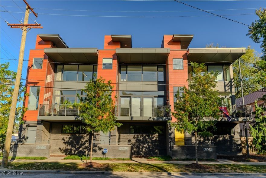 Duck Island 7 townhome! Rare opportunity to own one of the 7. This 2 bedroom, 2.5 bath Townhome was developed in an abundance of natural light, complemented by beautiful outdoor spaces, including a large balcony and rooftop deck. Green built/energy star compliant comes with TAX ABATEMENT through 2031! Lower level entrance holds an attached 2 car garage, a bonus room that is perfect for a home office or 3rd bedroom. The second floor is an open concept floor plan with 10' ceilings and floor to ceiling glass in living room. The living room connects to a large walk-out balcony, dining area, and gorgeous chefs kitchen with "Super White" marble countertops, island w/ cabinets and microwave, high-end cabinetry, a pantry and newly updated powder room. Enjoy a small balcony off the kitchen for your gas grill. Canadian Maple hard wood floors throughout the second floor and a statement floating steel staircase. The third floor features a bright and airy owners suite with walk-in closet and a stunning extra large bathroom with double sinks and beautiful tiled shower. The second bedroom has a wall of windows and a walk-in closet, laundry area. Step up to the incredible rooftop and enjoy the city views, and sunsets, tv hook up and plumbed for a wet bar. This development was built with the highest quality builders materials, brick and cement shingle siding, Pella Architect Series aluminum clad windows, steel staircase. Graber blinds throughout w/ motorized blinds in living and kitchen. Walking distance to Ohio City, Tremont, Westside market, Stadiums, breweries, dining and entertainment. The Redline greenway trail is just steps away and the soon to be finished Irish Town Bend Park! This is City living at it's finest.