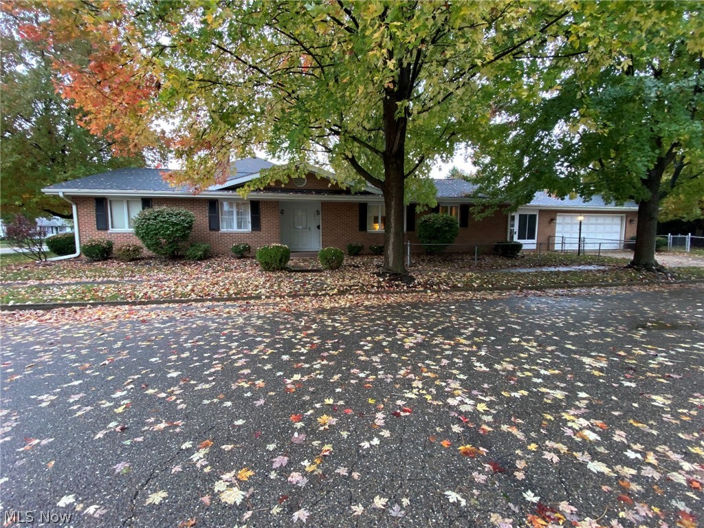 First time offered! Must see, all brick ranch home with 3 bedrooms 2.5 baths. Hardwood floors in the entry foyer. Quality oak kitchen with breakfast bar and new laminate plank flooring includes the appliances. Built in buffet in the dining area and formal dining room. Master bedroom with full bath. 24 X 12 enclosed side porch with new carpet. Finished rec room in the lower level. Anderson thermo windows. Fence enclosed, corner lot. 2 car attached garage. Excellent location, close to Tuscora Park. Taxes reflect the seller receiving a homestead credit of $360.92 annually.