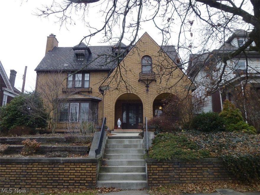 Very large solid brick home with 6 bedrooms, 3 full baths and 2 half baths. 4 fireplaces. Beautiful hardwood floors. 2 additional rooms without closets that can be used for office space, nursery, toy room, or whatever you please. Also a panty room between the kitchen and dining room. Basement has been waterproofed and has alot of finished living space including  the lovely library and a bath. 13.4x7 sun room off kitchen goes into fenced in back yard. Oversized 2 car garage has alot of storage with a stairway for additional storage above. Size of living room reflects what is currently the chapel room. There is a tax credit here because of the chapel.  3rd floor has 2 bedrooms and a full bath and also a room that houses the unit used for central air on 2nd and 3rd floor. This home has so much character and charm with the beautiful woodwork, stairway and hardwood floors.