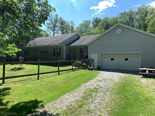 Are you looking to find your own private retreat away from the city? This home is entirely surrounded by trees except for the driveway! Built in 1994, this 3 bedroom, 3 bathroom ranch has all daily living on the first floor, and wait until you see the massive basement! This basement is prime and ready for an entirely finished retreat! The 28 x 40 garage is absolutely massive. It could easily fit 4 cars and more! There is a 14' door in the back of the garage. The front of the house has a fenced area for your fur family, and the back has an above ground pool (has not been open for 2 years). 3 acres of trees and privacy for that nature lover extend the depth of the property. Septic tank was cleaned and serviced last year. City water. The home also has a wood burner in the basement should you want a break from the gas prices. The furnace and AC was put in 2014. Two separate decks on the front of the house are perfect for daily relaxing. Bring your own personal touches and make this your own personal slice of paradise. Motivated seller.