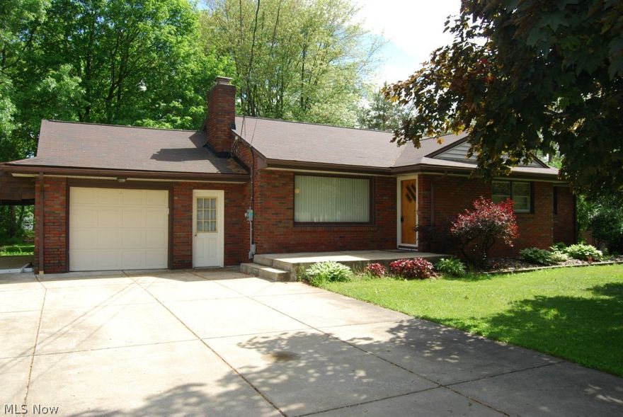 This adorable well maintained  MOVE IN READY brick ranch home sits on a quiet street in Austintown. This home features 3 bedrooms, one generous size bath and  spacious living room with fireplace. The kitchen includes all appliances and spacious dining room adjacent to the kitchen. There are finished hardwood floors under the carpet in the Master Bedroom, Dining room and Living Room. The roof was replaced in 2004, HWT in 2008, Updated electric in 2012, HVAC in 2013 and garage opener in 2012. The basement is very clean and spacious with a entertainment bar on one side of the basement. This house sits on a beautiful level lot with multiple trees. This is a definite must see!!! Call for a showing today!