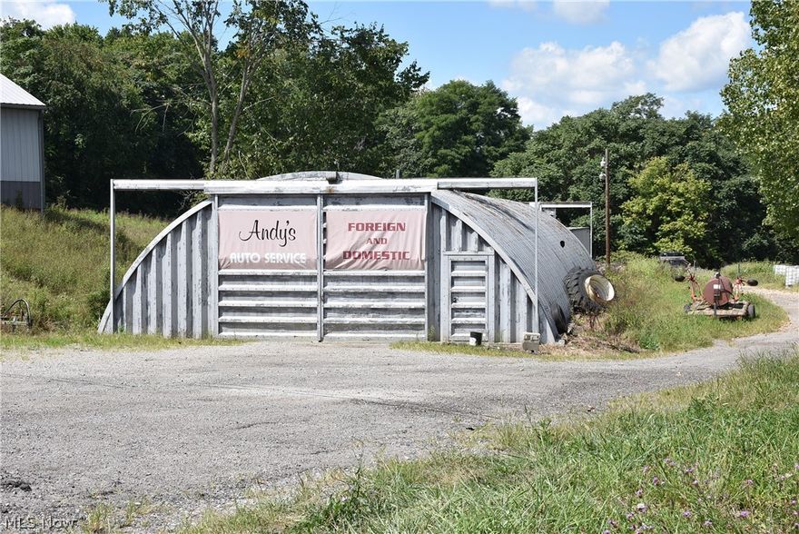 5.161 acres of land on State Route with convenient access to I70.  4,800 sq. ft. metal quonset building.  Gravel driveway into the building and could serve many purposes.  Retail sales or towing service, lawn care, storage.  Ample storage and parking.  Property being sold in "as is" conditiioin.  Public water, electric and small pond.  New survey shows acreage at 5.161.