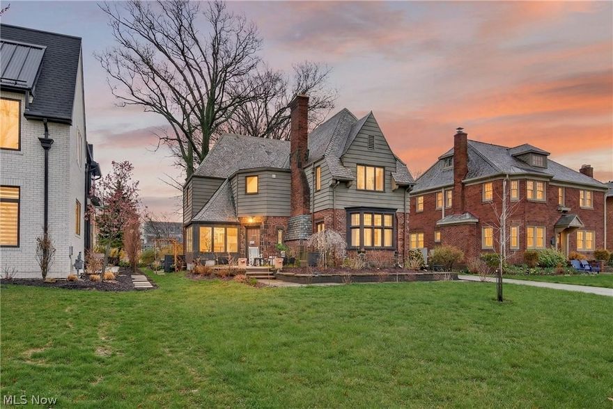Classic French Tudor charm meets extensive modern updates with Lake Erie views in one of Lakewood’s most sought-after neighborhoods pairing timeless architecture with modern upgrades. The home’s signature octagonal foyer opens to gracious living and dining spaces and a light-filled office captures stunning views of the lake. Thoughtfully reimagined since its last sale, this 1920s gem has been meticulously updated with a bespoke kitchen that combines both beauty and performance appointed with soapstone countertops, Dolomite backsplash, new cabinetry, and a suite of high-end appliances; including Miele integrated refrigerator/freezer, wall ovens, induction cooktop/hood, and Fisher & Paykel double Dish-Drawer. Major improvements provide both style and peace of mind, including a new 200-amp electrical panel, recently constructed one-car garage with EV charging capability, new concrete driveway and replacement of the storm drainage system now tied into the city infrastructure. Nature Stone flooring has been added to the finished basement area and the Unico a/c system is a great asset. Bathrooms have been tastefully remodeled, including a fully updated primary bath with walk-in shower and bidet, a refreshed main-level powder room, and renovated third-floor bathroom featuring a freestanding soaking tub. While every modern comfort has been seamlessly integrated, the home’s rich architectural details remain lovingly preserved, from the original leaded glass and pristine hardwood floors to the intricate crown molding and stunning stone living room fireplace. The second level offers a generous owner’s suite with gas fireplace and two additional bedrooms share a Jack-and-Jill full bath. A private third-floor suite provides ideal accommodations or bonus space. The yard has been thoughtfully designed to complement this home’s beauty. Enjoy a newly designed front terrace crafted from porcelain and sandstone, regraded grounds, a connecting side pathway, and a private rear patio.