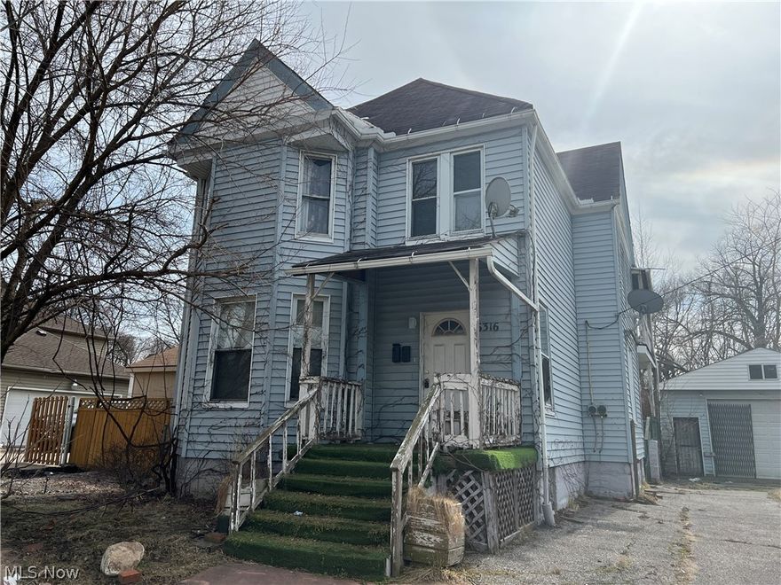 Double in excellent location that needs full rehab.  Nestled among new construction.  Older rental property with good bones in great neighborhood close to downtown and university circle.  Vinyl siding.  Newer two car garage.  This is an as is sale.  Seller will not clean out.  Great potential to be a big money maker.