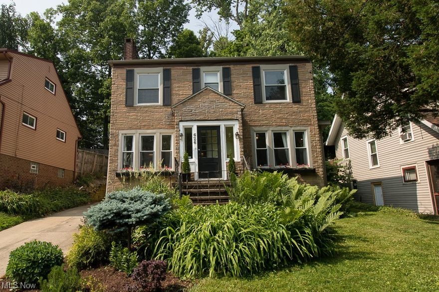 A classic colonial on a charming red brick road in Highland Square awaits your arrival! Exceptional property with bright light throughout and many updates. On the first floor you will find a large living room with a working fireplace that opens to both the spacious dining room and den/office with built-in shelves and French doors for privacy. The kitchen is newly updated with cabinets, stainless steel appliances, solid surface countertops and beautiful ceramic tile flooring. Enjoy the private backyard with patio and a hot tub. Enter the back door into a nice size mud room where a newly updated half bath is located. Upstairs you will find 4 nice sized bedrooms and a large full bathroom, plus a walk up attic, perfect for additional storage. One bedroom has a door that leads to a potential upper deck. Large basement with very high ceilings lends itself to much potential. Modern neutral paint throughout! Recent updates include roof in 2017, waterproofing and new water line to the street in