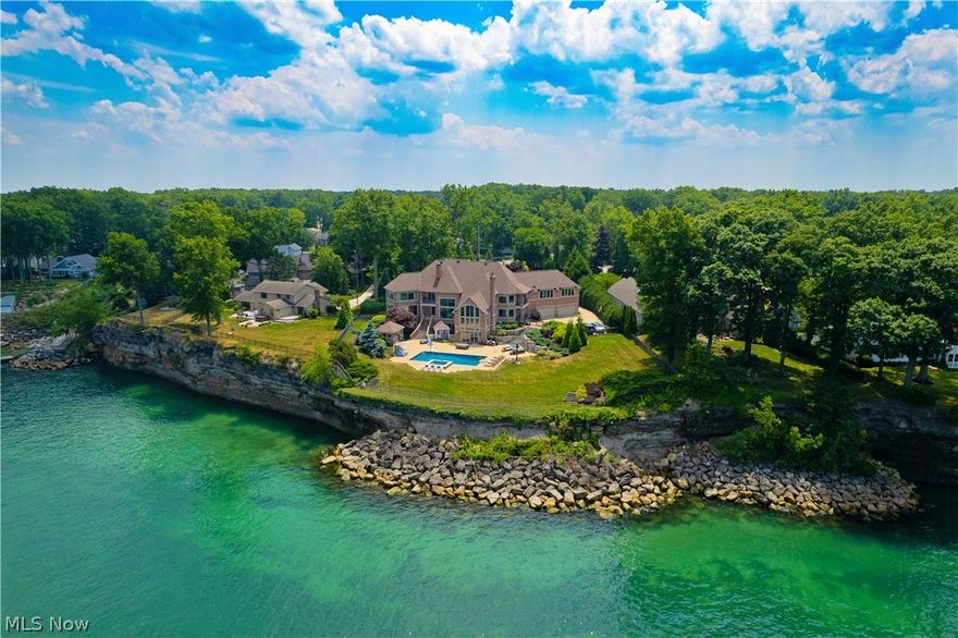Introducing a breathtaking lakefront home that offers an exceptional living experience. This extraordinary residence features floor-to-ceiling windows that showcase priceless views, and an interior that exemplifies luxury. Highlights include a spacious first-floor primary suite with an office, a second primary suite on the upper level, and a walk-out lower level. Additional amenities include a state-of-the-art movie theater, a fitness gym equipped with a locker room, and a second kitchen for added convenience. One feature you absolutely won't want to miss is a hidden gem that promises a delightful surprise. The outdoor space, spanning 2.18 acres, is a dream come true, featuring an inground pool, hot tub, poolhouse, and pristine grounds that provide ultimate privacy. The gated entrance ensures security and exclusivity. As a lakefront property, it offers the most beautiful sunset water views that will take your breath away. This home is truly stunning, offering luxury and comfort both inside and out. You're in for a treat!
