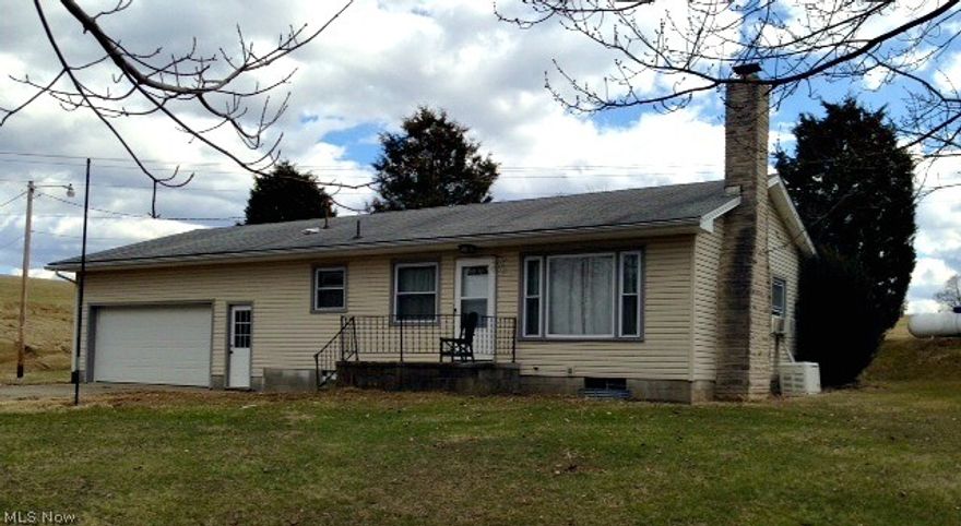 Cute 2 bedroom ranch on over half an acre.  New hardwood floors in kitchen, livingroom and bathroom, wood burning fireplace, full basement and 2 car attached garage