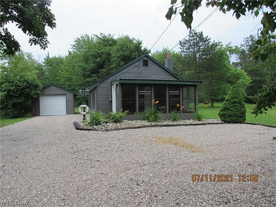 Call it home year round or just when you want to get away. Recently updated inside and out with; garage roof (June 2021), house roof (2014), hot water tank (2019), vinyl flooring throughout (2021), some plumbing updated and electrical updated (2021). The eat in kitchen offers nice counter space, plenty of cabinets and newer stainless steel appliances. The newly updated bathroom is one of a kind and features a ceramic tiled shower with dispenser. Nice size mud room/utility room at the back of the house. If you like to be outside, you will love the yard and the enclosed front porch on rainy days! BIG side yard and a nice secluded hangout in the woods perfect for camping or cooking out. Excellent location just minutes from Lake Erie, Village Green Golf Course, N. Kingsville Sand Barrens and less than 15 minutes to Ashtabula Harbor and the Port of Conneaut with easy access to main roads and I-90.