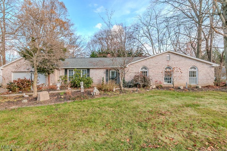 Welcome to this spacious brick ranch nestled in a lovely neighborhood just steps from a local golf course and located within the desirable Madison Local School District. This beautifully updated home offers comfort, charm, and room to grow. Inside, the entire interior has been freshly painted in a neutral color, all floors have been replaced with wood laminate, and both the formal living room and family room feature wood-burning fireplaces that were cleaned and inspected in 2024. The eat-in kitchen includes soft-close cabinets, vinyl flooring, all appliances, two added chandeliers, and stunning granite countertops installed in 2024 along with a new farm sink, disposal, and faucet. The family room’s sliding door has been replaced, as have the front entry door and security door, and a convenient man door has been added to the garage. The en-suite bathroom has been updated, and mechanical improvements include a new Rheem Performance water tank installed in Spring 2023, along with new gutters. A custom brick walkway enhances the front entry, while the private fenced back patio offers a deck, fireplace, and astroturf for zero-maintenance outdoor enjoyment. This all-brick home sits just a five-minute walk from Lake Erie and features a large yard with a charming wood gazebo, perfect for dining, hosting, or relaxing. With generous living space, extensive updates throughout, and a peaceful, well-kept neighborhood, this home is truly move-in ready immediately and offers the best of comfort, convenience, and community.