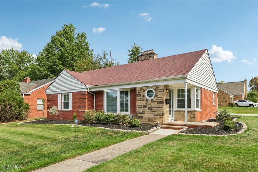 Welcome to 1073 Hereford Rd in Cleveland Heights, located in the historical Forest Hills community. This beautifully renovated brick ranch blends timeless 1950s charm with today’s modern design and features a new fenced in backyard. The staged photos will help you envision the versatile layout for your future furniture placement. Every detail has been thoughtfully updated inside and out with top notch materials and quality of work. Head in through the front door and notice the spacious living room that showcases refinished hardwood floors and a striking wood-burning fireplace with herringbone tile. The open concept offers a bright dining area that flows seamlessly into the brand-new kitchen, featuring Shaker-style soft close cabinetry, quartz countertops, a stylish herringbone backsplash, sideboard serving area and stainless steel appliances, including a counter-depth refrigerator and 5-burner gas range. All of the bedrooms feature rich hardwood flooring and matching wood ceiling fans, with crisp white panel doors and updated hardware provide a fresh, cohesive look throughout. The main bath blends classic white subway tile with an octagon tile floor, accented by a black vanity and brushed gold fixtures for a touch of drama. The expansive lower level offers endless possibilities with the sandstone fireplace with room for a billiards table, a wet bar or a priceless space for movie nights. The spa-like full bath features a walk-in shower with wave-pattern tile, rainfall showerhead, hand-held wand and four spray jets. Every major mechanical system has been upgraded: 95% energy-efficient furnace and A/C, new 200-amp electric panel with updated meter and service line, 50-gallon hot water tank, new plumbing, fully insulated walls and attic, energy-efficient windows throughout, waterproofed basement, sump pump, and more. The 2-car garage with opener has a newer floor and driveway. Ask about the 7 year property tax abatement and schedule your private tour today!