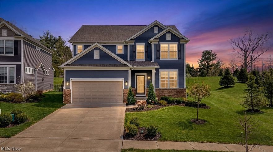 Welcome to this beautifully crafted 2021-built home located in the highly desirable Reserve at North Woods in Macedonia. Offering 4 bedrooms and 2.5 bathrooms, this exceptional residence combines modern design with everyday functionality. Step into a welcoming foyer that opens to a versatile front living room or private office. The main level features an open-concept layout with luxury vinyl flooring and a cozy gas fireplace, creating a warm and inviting atmosphere. The gourmet kitchen is the centerpiece of the home, complete with quartz countertops, stainless steel appliances, and a large center island ideal for entertaining and daily living. Just off the kitchen, enjoy seamless indoor-outdoor living with access to a composite deck overlooking a fully fenced backyard (2023). Whether relaxing or hosting, this outdoor space is designed for comfort and privacy. Upstairs, the oversized primary suite offers a true retreat, featuring a private sitting area, walk-in closet, and a en-suite bathroom with dual granite vanities and a tiled shower. Three additional generously sized bedrooms share a well-appointed full bath. A convenient second-floor laundry room adds to the home’s practicality. The huge unfinished basement provides excellent potential for future finishing, allowing you to customize additional living space to fit your needs. Outside, enjoy thoughtfully designed landscaping with established garden beds—perfect for growing fresh vegetables or creating your own flower arrangements. Entertain effortlessly on the newly built concrete patio (2025), expanding your outdoor living options. Located within the Nordonia Hills School District and offering easy access to shopping, dining, and major highways, this home delivers both comfort and convenience. Schedule your private showing today and experience everything this exceptional home has to offer!