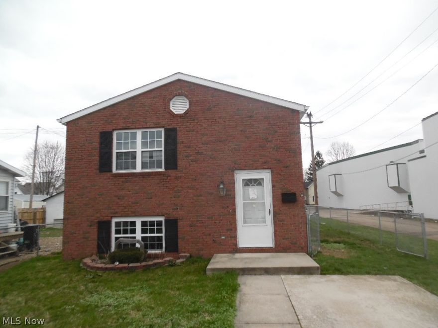 A nice brick front 2 story with 2 bed and 1 bath. The kitchen has oak cabinets, wood flooring a refrigerator and range. There is a full basement that more rooms can be added. A nice backyard with a chain link fence and small concrete patio .