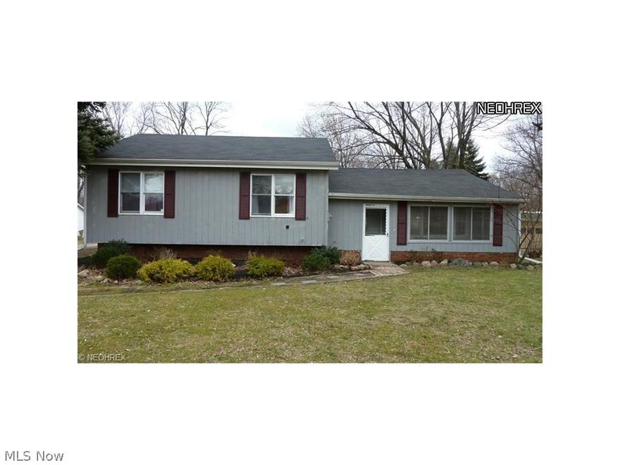 Welcome Home!! Be prepared to fall in love with this beautifully renovated 3 bdrm / 2 full bath  split level.  Feel the warmth as you enter spacious living room w/new carpet & paint/beautiful laminated wood like floors thru out the rest of the home. Totally remodeled kitchen & bath's! Dining area has sliding doors that lead out to  very large backyard. The lower level features a full bath, and family room to entertain or relax by the TV. The upper level offers another full bath, and 3 generous sized bedrooms, for very comfortable living.  Extra large 32x24 garage with opener and electric, perfect for car buff. Covered deck off the garage to enjoy those summer nights.  This house has a lot to offer on 1 full acre. Painesville Township schools.  Other updates include sump pump  w/a lifetime warranty. Hot water tank 2009 & roof 2005. Home Warranty too..  Ready for you to MOVE RIGHT IN!
