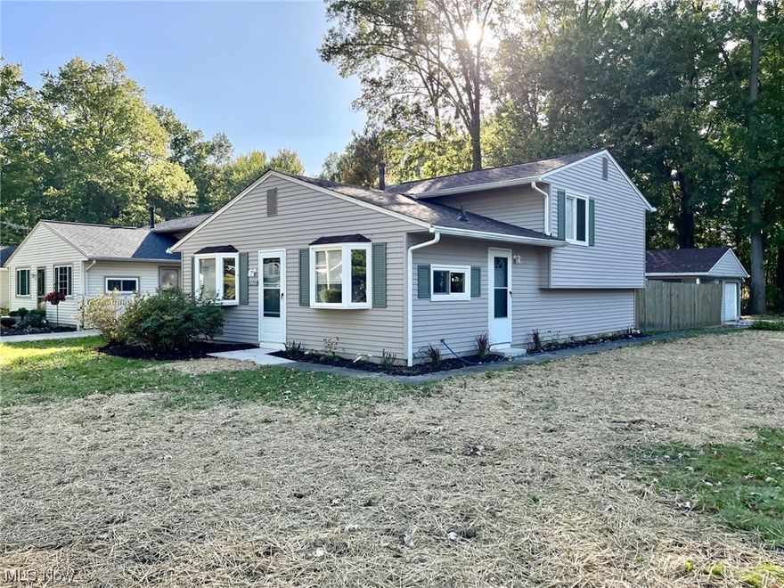 Completely remodeled split level now available in North Ridgeville. This is a perfect location just minutes to Lear road and l-480. Gorgeous interior with remodeled eat-in kitchen 2023 which includes granite counter, new cabinets, sink, fixtures and pantry closet. Remodeled baths 2023 includes new 36-inch vanity, tub surround, flooring and lights. Spacious living room with coat closet and lower level family room with convenient half bath. Plus large utility room with extra space for expansion. Lots of extra storage with a huge crawl space as well. So many updates include roof and gutters 2023, new driveway and garage floor 2023, updated lighting, doors and some replacement windows. Located just east of Lear Nagel Rd makes this a perfect location close to shopping, highways, schools and more. Schedule your tour today.