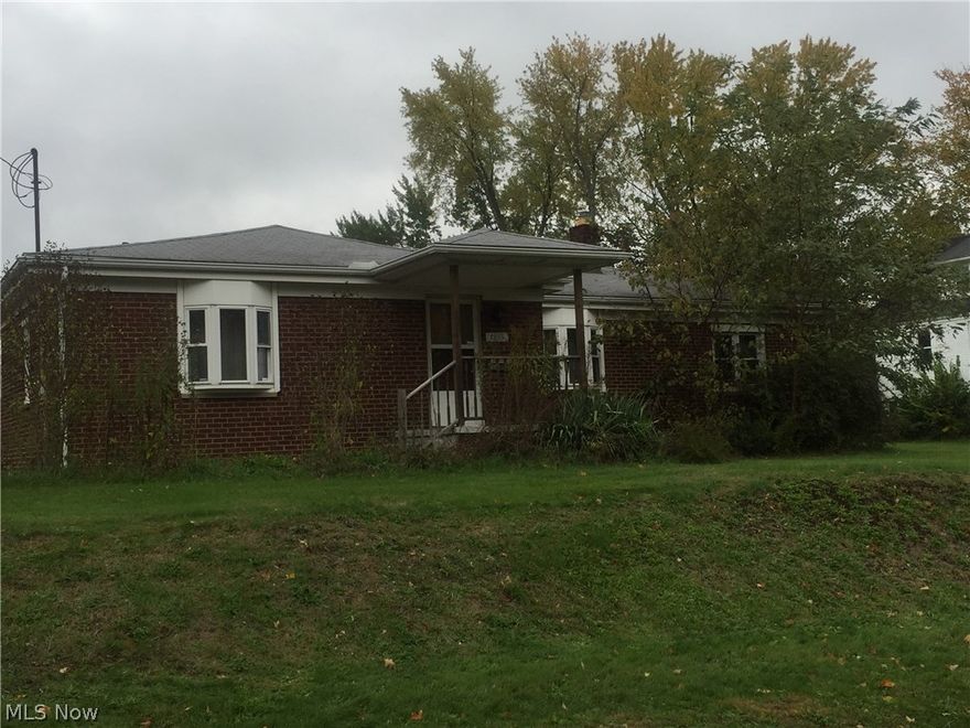 Brick ranch with enclosed porch with 2 entrances into the main living area and 1 entrance into the additional suite.  Additional living suite is set up as a separate apartment with access to the main living area.  Main living area has 2 bedrooms and an handicap accessible walk-in tub.